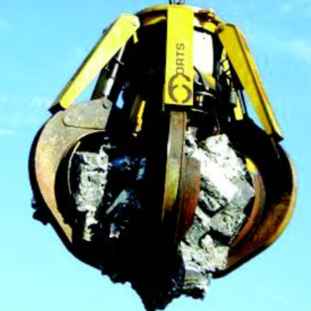 Diesel-hydraulic orange peel grab, remote-controlled type DHM is in the air against a blue sky, safely enclosing the rubble