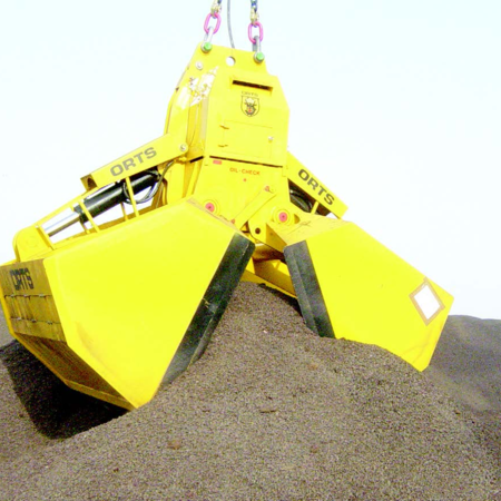 Yellow electro-hydraulic clamshell bucket type EHS-B grabs gray gravel