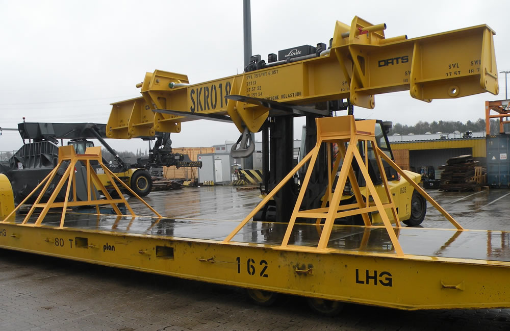 75t load beam / traverse with several lashing points for multi-purpose use on container cranes is transported on a forklift truck